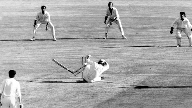 Batsman Terry Jenner on ground after being struck on back of head by a John Snow bouncer.