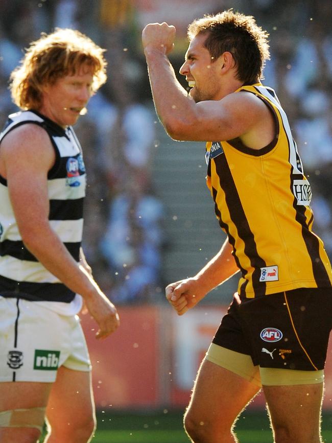 2008 Norm Smith medallist Hodge celebrates a goal against the Cats.