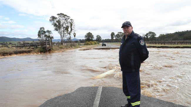 Hunter Valley RFS District Operational Officer John Ryan inspects the broken road. Picture: David Swift