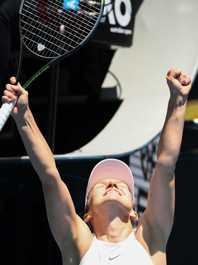 Simona Halep raises her fists to the heavens after her victory. Picture: AFP