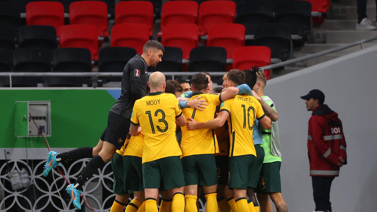 The Socceroos celebrate during their win over the UAE. Picture: KARIM JAAFAR / AFP
