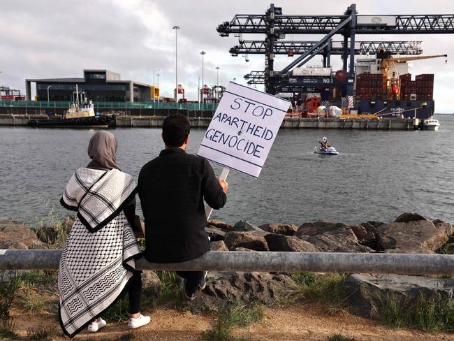 Members of the Australian Palestinian community hold placards during a protest at the Port Botany terminal. Picture: DAVID GRAY / AFP)