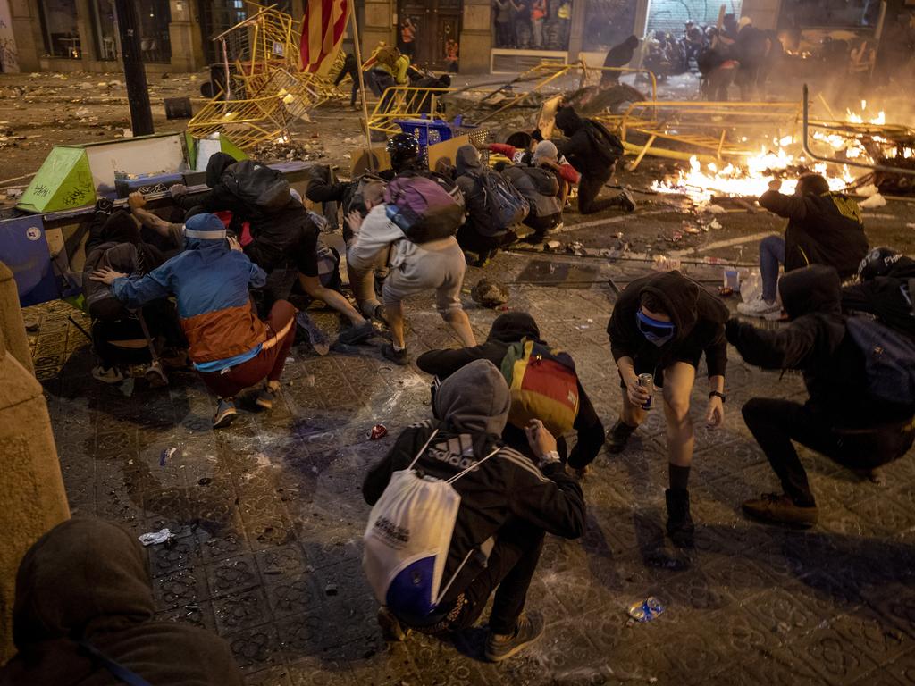 The clashes have raged for a week, with the iconic tourist destination bracing for more violence spurred by the conviction of a dozen Catalan independence leaders. Picture: AP Photo