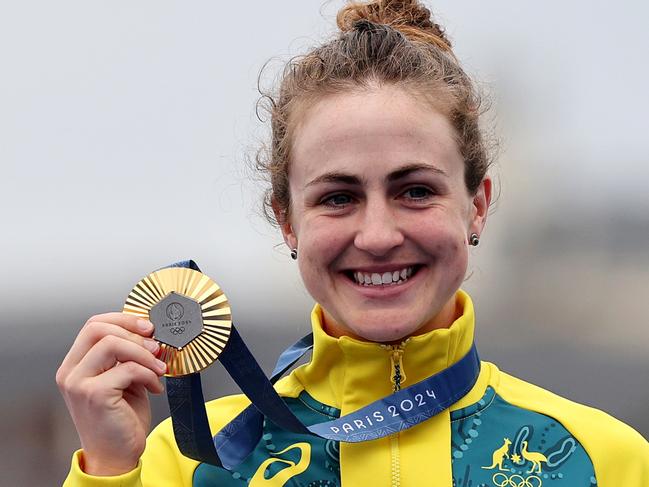 PARIS, FRANCE - JULY 27: Gold medalist Grace Brown of Team Australia poses on the podium during the Women's Individual Time Trial on day one of the Olympic Games Paris 2024 at Pont Alexandre III on July 27, 2024 in Paris, France. (Photo by Tim de Waele/Getty Images)