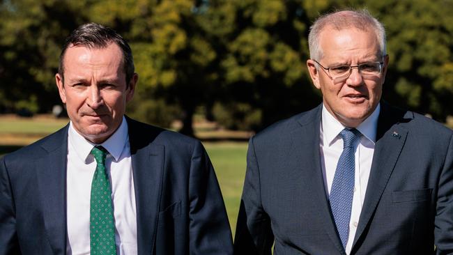 WA Premier Mark McGowan (left) and Prime Minister Scott Morrison are seen arriving for a press conference in Perth, Thursday, March 17, 2022.  (AAP Image/Richard Wainwright) NO ARCHIVING