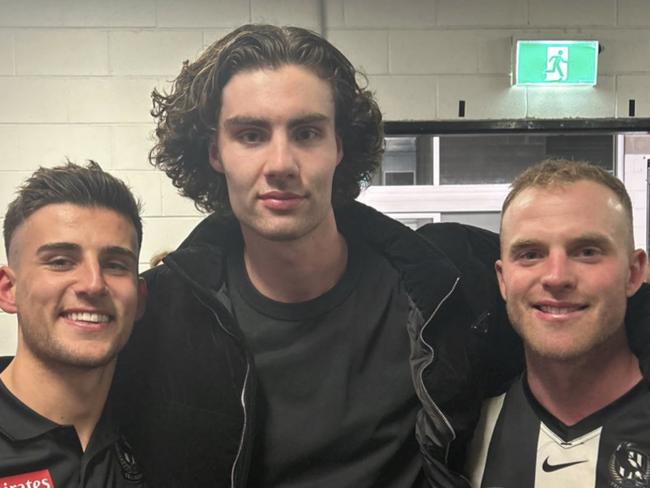 Nick Daicos, Josh Giddey and Tom Mitchell in the rooms post-match.