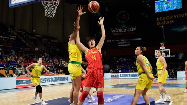 Australia's center Liz Cambage (2L) blocks China's Yueru Li (3R). Picture: AFP