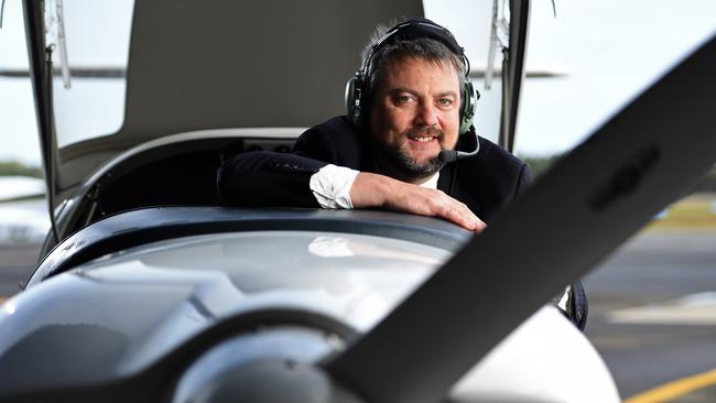 Hartwig Air director David Johnston with a plane at Parafield Airport. Picture: Tom Huntley