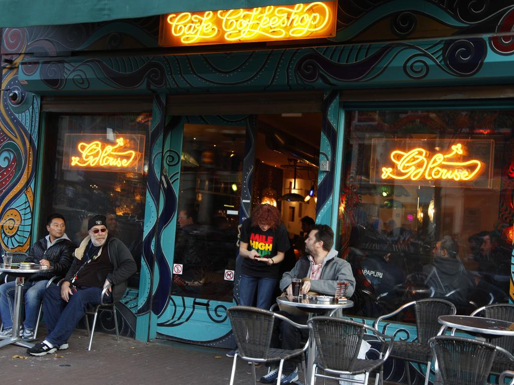 Customers outside the coffee shop The Green House in Amsterdam, Netherlands. Picture: Peter Dejong