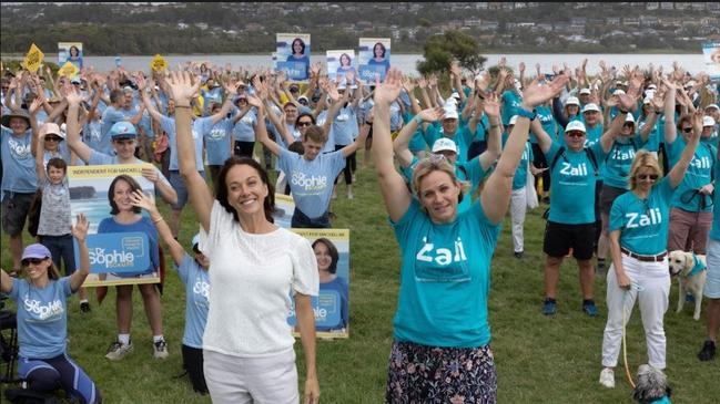 Independent MP for Warringah Zali Steggall (right) and independent candidate for Mackellar Sophie Scamps with their supporters at Dee Why Beach.