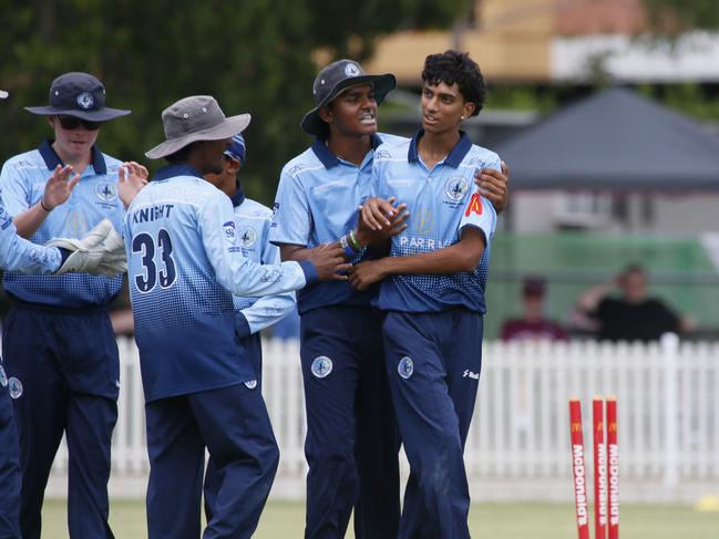 Arhan Shah is mobbed by teammates after bowling Xander Carstens. Picture Warren Gannon Photography