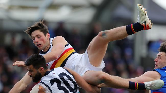 Adelaide's Chayce Jones crashing over the pack against the Bulldogs in his breakout game. Pic: Michael Klein