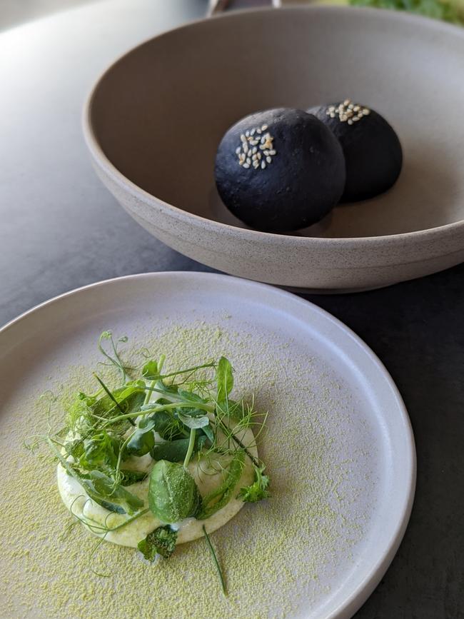 Charcoal sweet bun and oyster crema with seasonal greens. Picture Hanmo Li