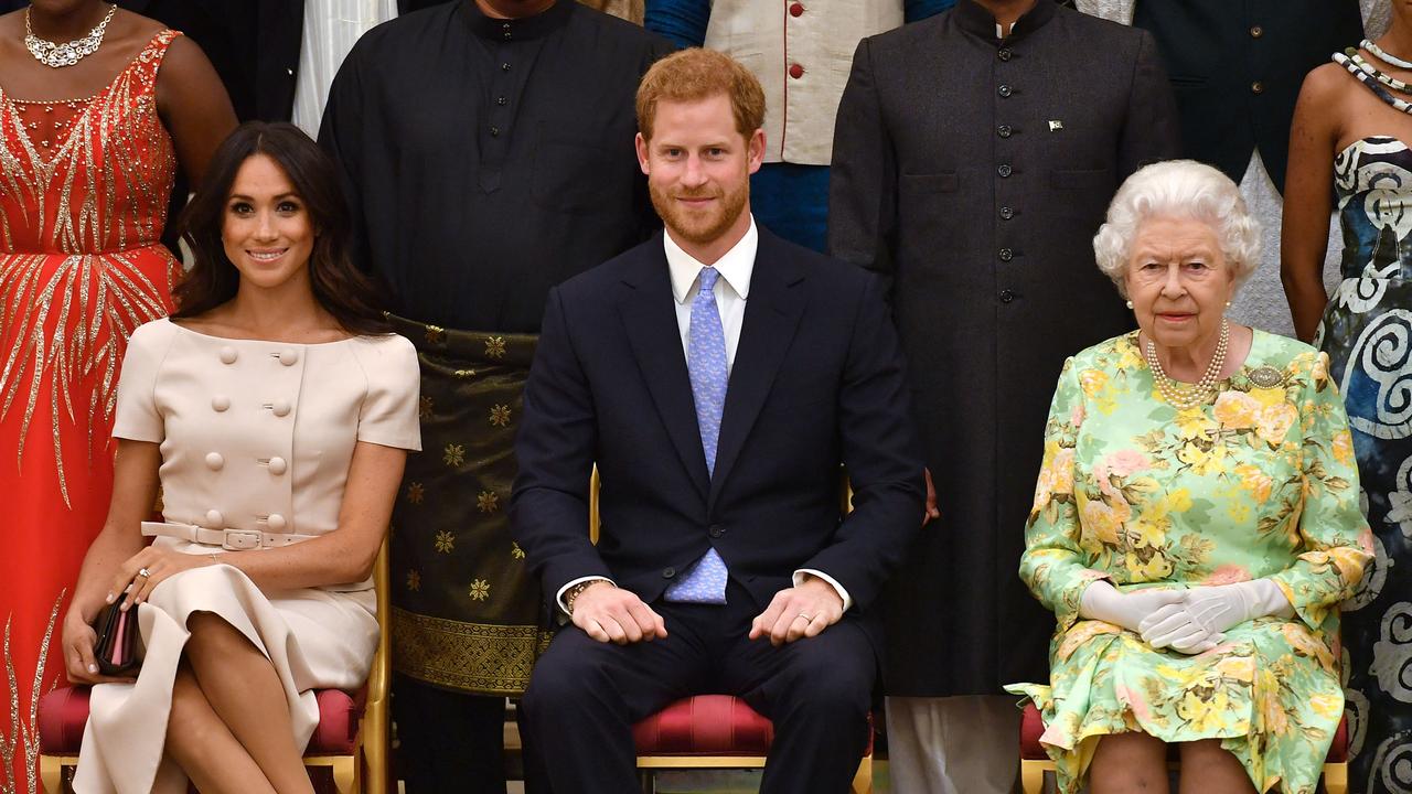 Meghan, Duchess of Sussex, Prince Harry, Duke of Sussex and Queen Elizabeth on June 26, 2018 at Buckingham Palace in London. Picture: John Stillwell/AFP