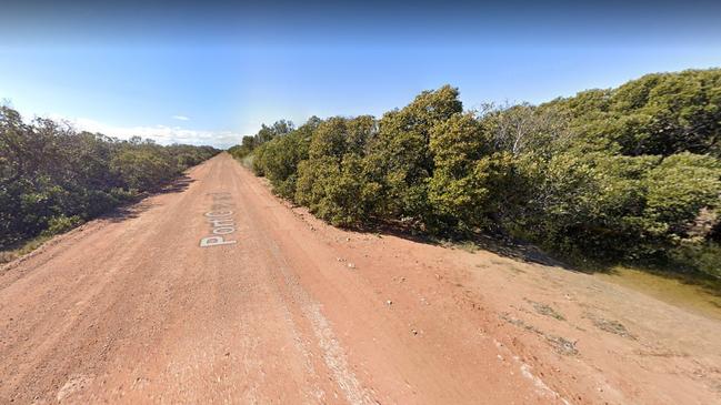 The remote road where police say a man's burnt-out car was found with him alongside it. Picture: Google