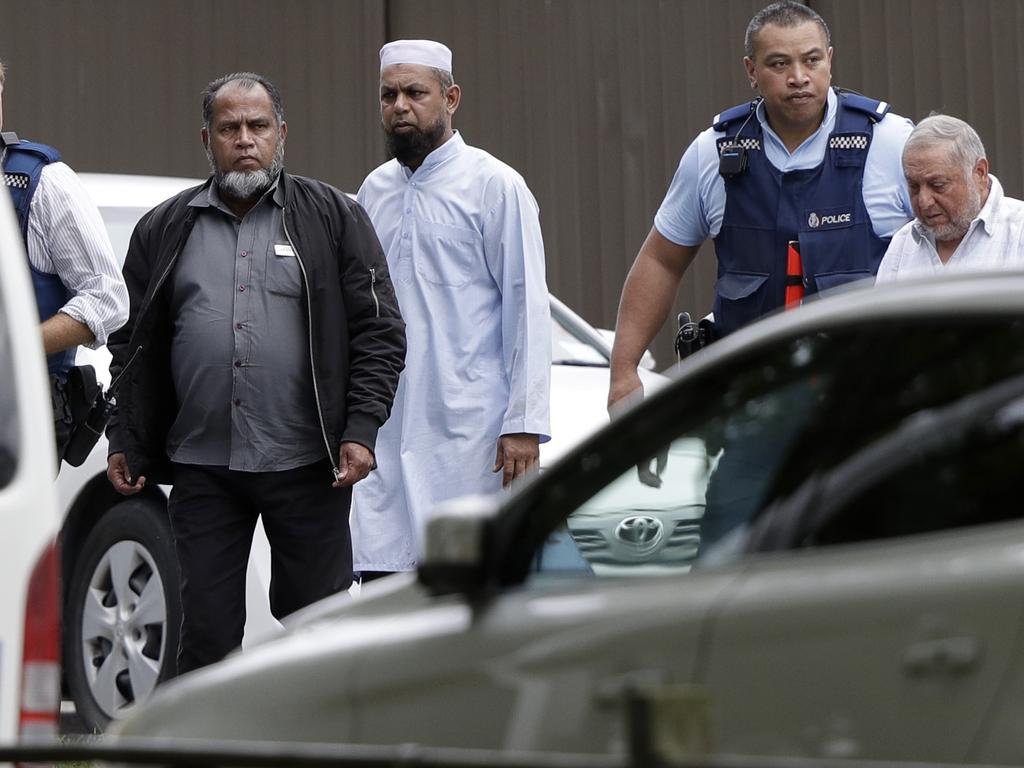 Police escort men from Linwood mosque. Picture: AP