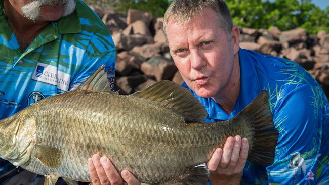 Major Events Minister Paul Kirby holding the tagged million dollar barramundi as he officially open season nine of the Million Dollar Fish competition. Picture: Pema Tamang Pakhrin