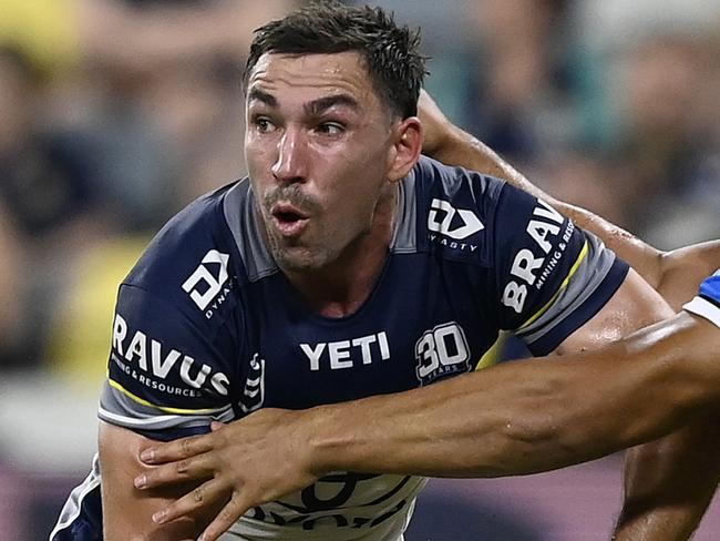 TOWNSVILLE, AUSTRALIA - MAY 31: Reece Robson of the Cowboys is tackled by Sione Fainu of the Tigers during the round 13 NRL match between North Queensland Cowboys and Wests Tigers at Queensland Country Bank Stadium on May 31, 2025, in Townsville, Australia. (Photo by Ian Hitchcock/Getty Images)