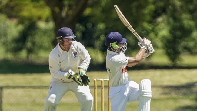 Long Island keeper Aiden McKenna and Thisuraka Akmeemana batting for Heatherhill.