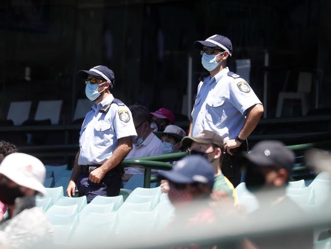 NSW Police officers keeping an eye on the crowd in the stands on day 5 of the 3rd cricket Test between Australia and India at the SCG. Picture: Jonathan Ng