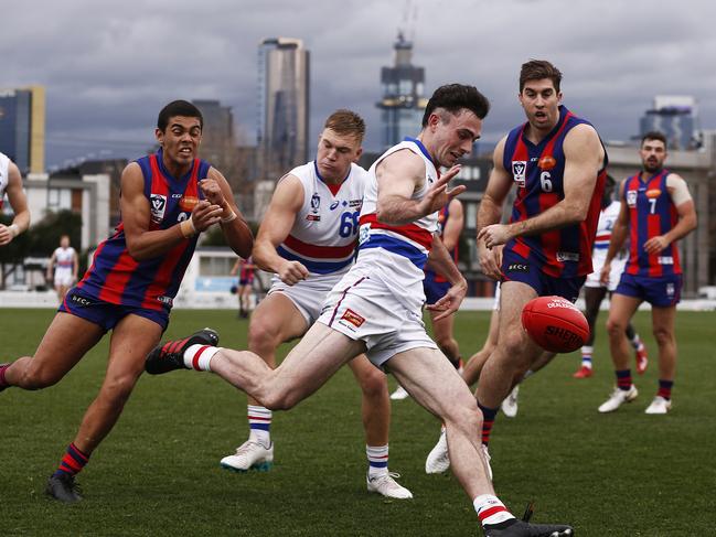 Best-afield Toby McLean takes a kick for the Bulldogs.