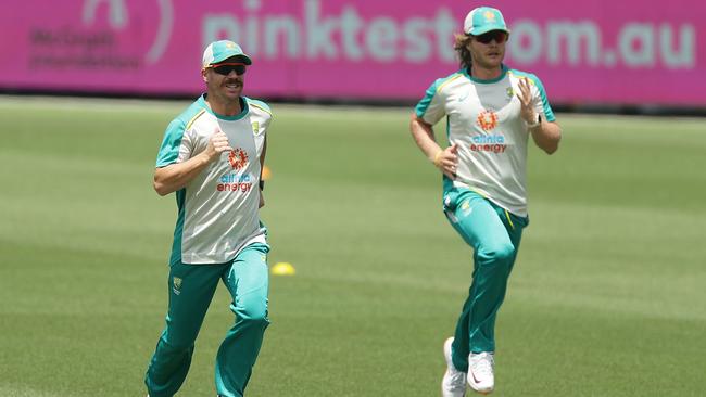 David Warner and Will Pucovski are put through their paces at training. Picture: Mark Metcalfe/Getty Images