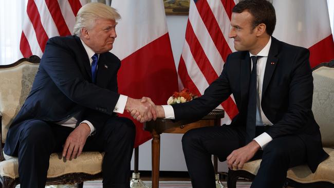 US President Donald Trump’s handshake with French President Emmanuel Macron made headlines. Picture: AP Photo/Evan Vucci