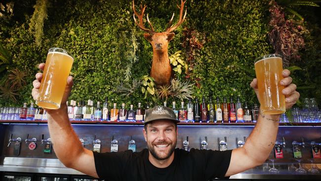 Owner Cuan Roberts behind the bar with beers and Frank the Stag. Picture Glenn Hampson