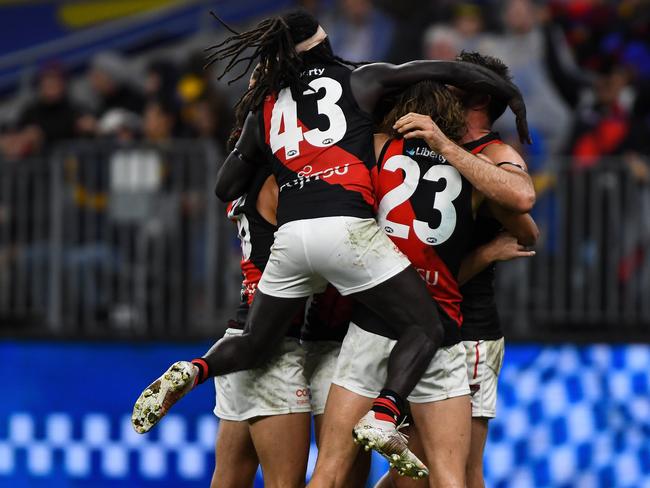 Ecstatic Bombers swamp Jake Stringer. Picture: AFL Photos/Getty Images