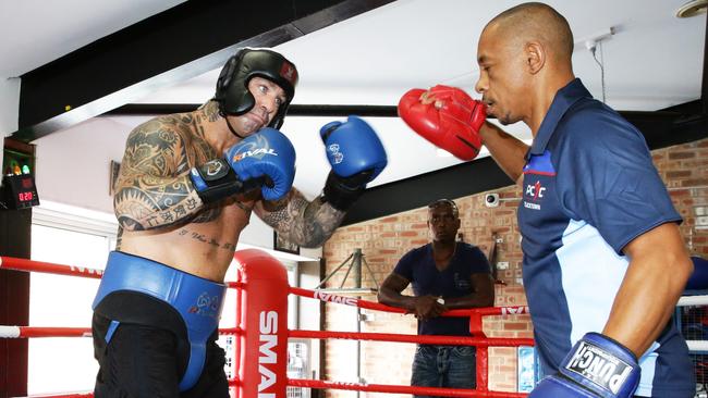 Lucas Browne works with trainer Rodney Williams at Blacktown PCYC.