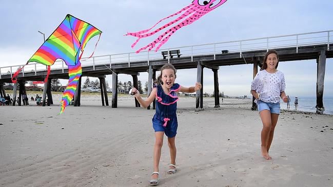 Chanel Maio, 7, and her sister Chelsea Maio, 11, at Grange Beach. Picture: Mark Brake