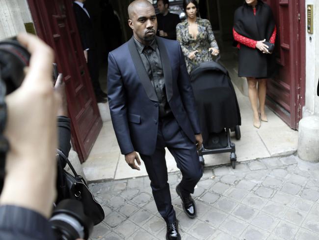 Kanye leads the way to their umpteenth pre-wedding event.
