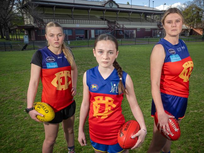 Fitzroy footy players upset over delays to the construction of a club pavilion, from left, Olive Nicholson, Tilly Smith and Tori Tonzing. Picture: Tony Gough