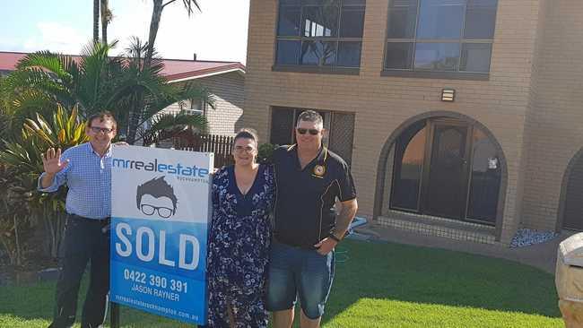 HAPPY BUYERS: Mr Real Estate principal Jason Rayner with delighted property purchasers Belinda Wonson and David Thorburn. Picture: Contributed