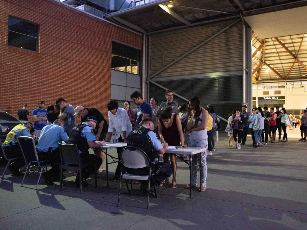 Evacuees photographed inside of the exhibition hall where they are staying. Picture: Flavio Brancaleone