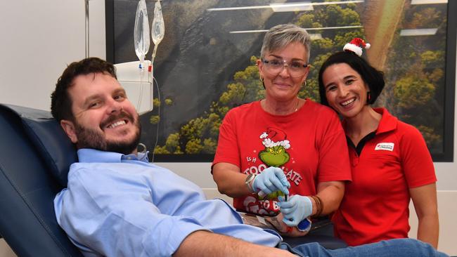 Herbert MP Phillip Thompson rolls up his sleeve for the Christmas Blood Blitz, with help from RN Angela Simon and Lifeblood North Queensland relationship manager Gwendolyne Camaret at the Townsville Lifeblood Donor Centre. Picture: Evan Morgan