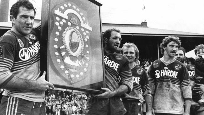 Mick Cronin and Ray Price hold the JJ Giltinan Shield alongside Peter Sterling and Brett Kenny after Parramatta defeated Canterbury in 1986 grand final at the SCG.