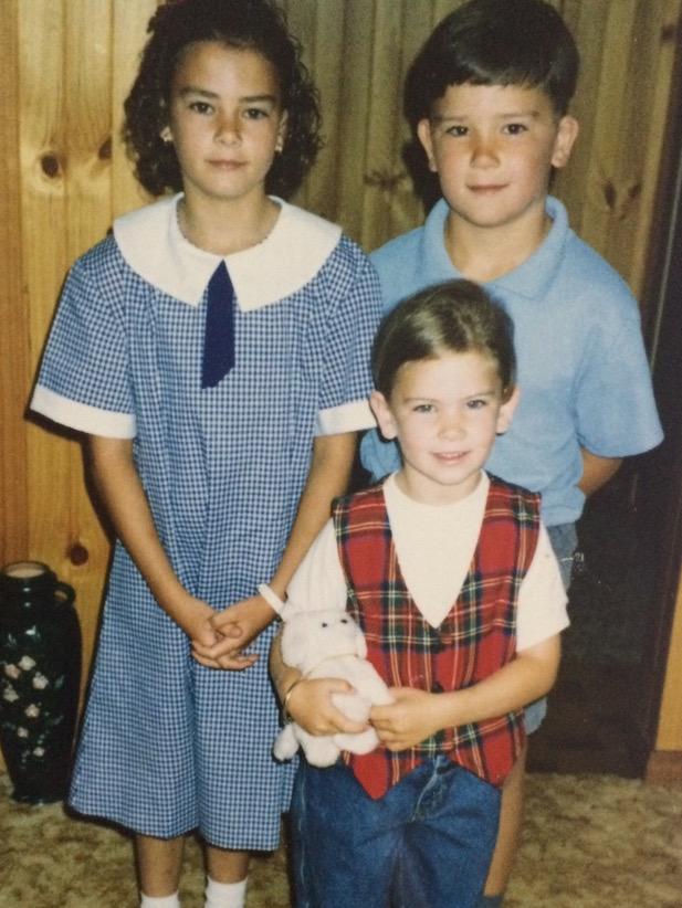 Lewis with sisters Monique (left) and Chelsea (front). Picture: Supplied