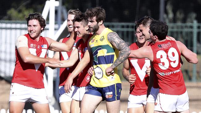 29/04/18 - SANFL - Eagles v North Adelaide at Woodville Oval. Jack Firns not impressed about being in the middle of North's goal celebrations . Picture SARAH REED