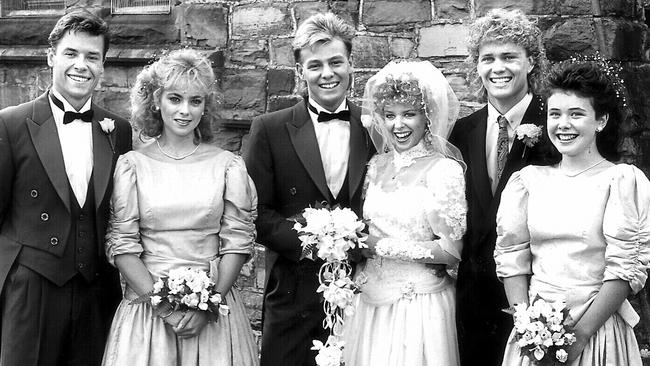 Annie Jones with Guy Pearce, Jason Donovan, Kylie Minogue, Craig McLachlan and Sasha Close on Neighbours in 1987 has all of the things crossed that Neighbours will find a saviour. Picture: Supplied