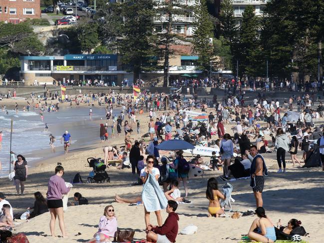 People enjoying the unseasonably warm weather at Manly Beach as the temperature reached 25ÃÂ°C. Picture: Jonathan Ng