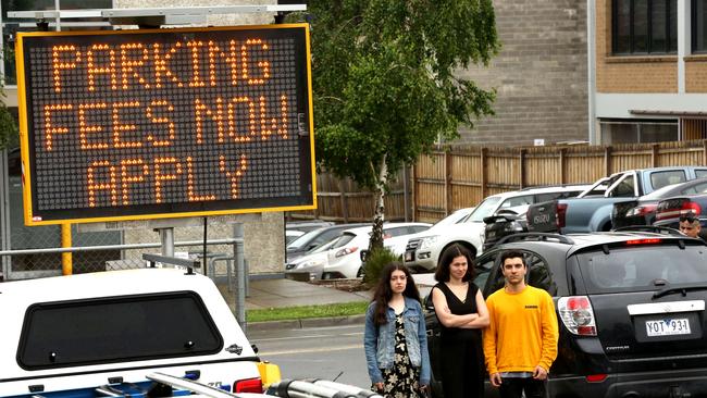 Eastland is now charging staff and patrons to park in two off-site carparks once free for staff. Employees Stephanie Mortlock, Caitlin Khaw and Nick Tsagaris have started an online petition protesting the changes.. Picture: Stuart Milligan