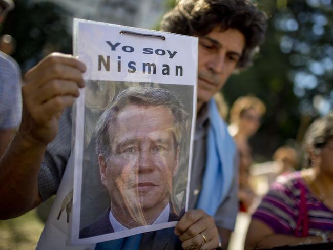 A demonstrator holds a photo of late prosecutor Alberto Nisman.