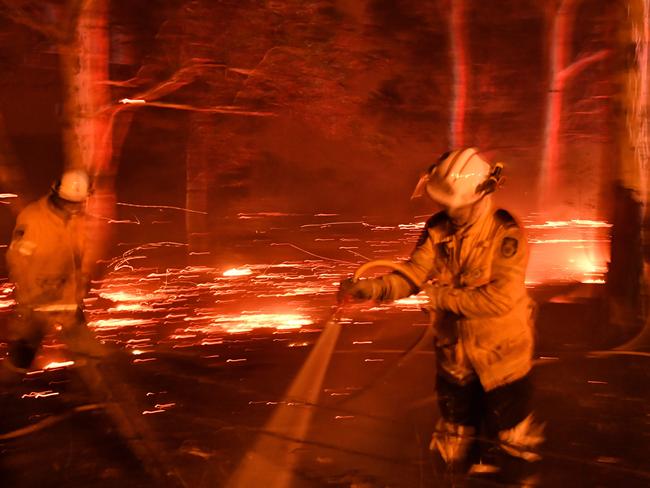 Firefighters battle bushfires near Nowra on December 31, 2019, during the Black Summer. Picture: AFP