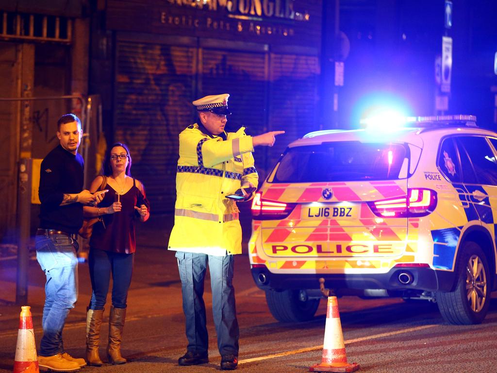 Police stand by a cordoned off street close to the Manchester Arena in Manchester, England. Picture: Getty