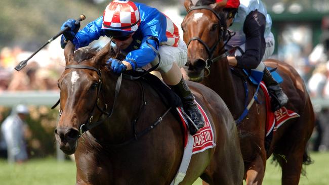 01/11/2005. Makybe Diva, ridden by Glen Boss, leads Xcellent, ridden by Michael Coleman in the 2005 Melbourne Cup.