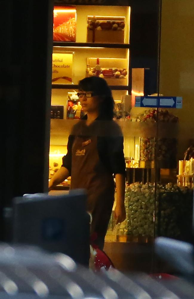 Fiona Ma, one of the youngest hostages and trusted by Man Monis, is ordered to switch off the lights in the Lindt Cafe. Picture: Craig Greenhill