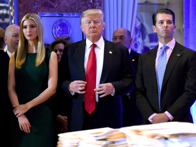 (FILES) In this file photo taken on January 11, 2017 US President-elect Donald Trump stands with his children Ivanka and Donald Jr., during Trump's press conference at Trump Tower in New York. - A US judge ruled on February 17, 2022 that former president Donald Trump must testify under oath in New York's civil probe into alleged fraudulent business practices at his family business. State judge Arthur Engoron ordered Trump and his two eldest children, Donald Jr and Ivanka, to comply with subpoenas issued by New York Attorney General Letitia James. (Photo by TIMOTHY A. CLARY / AFP)