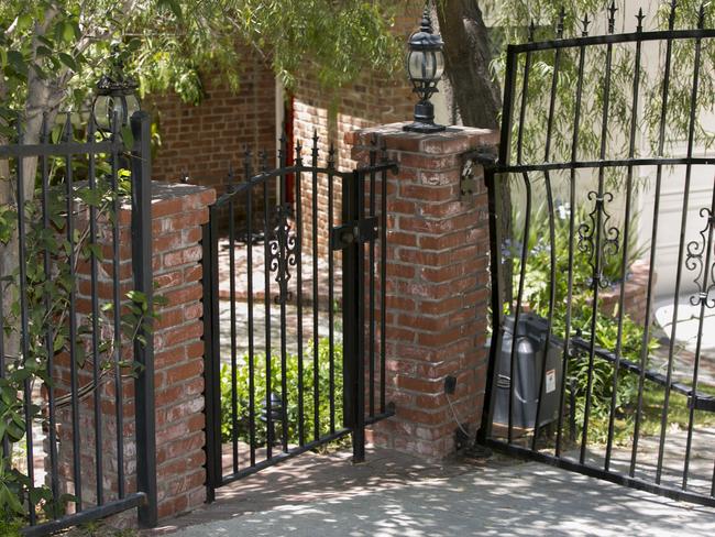 The damaged gate at the home of Anton Yelchin who died in a freak accident. Picture: AP Photo/Damian Dovarganes