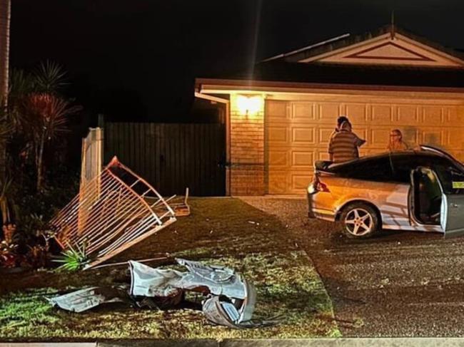 Man charged with drink driving after car smashes through fence